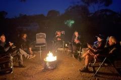 Sitting-around-our-camp-fire-with-Redtrack-Tours